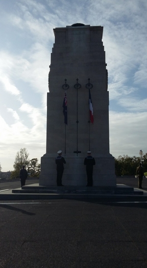 Navy personnel raising the New Zealand and French flag